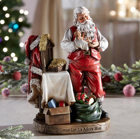 Adoring Santa With Baby Jesus Christmas Statue